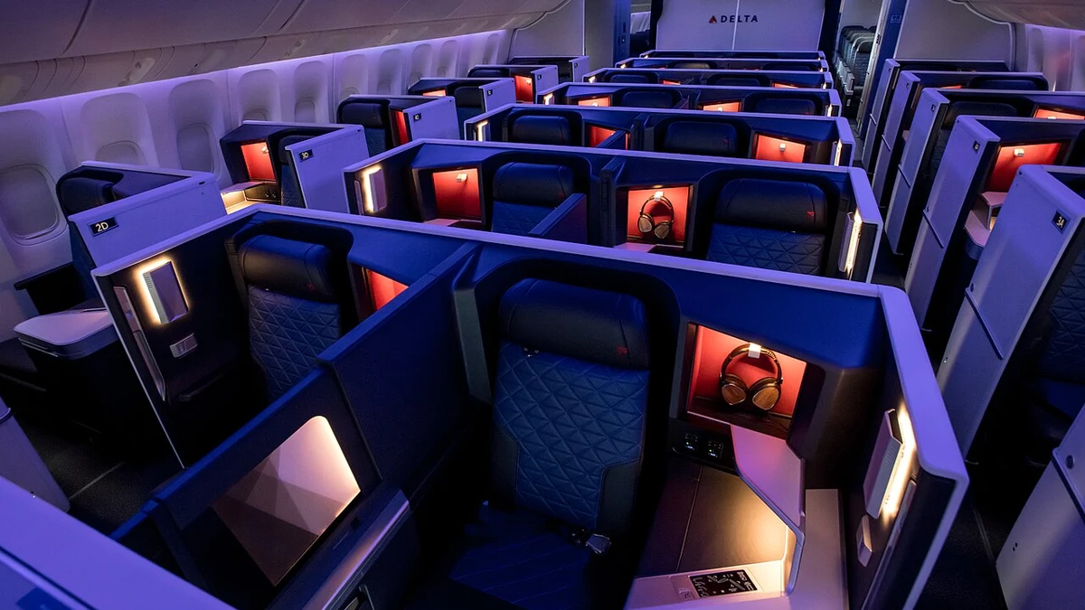 Delta One Suites luxury cabin interior with in-seat device connectivity and entertainment