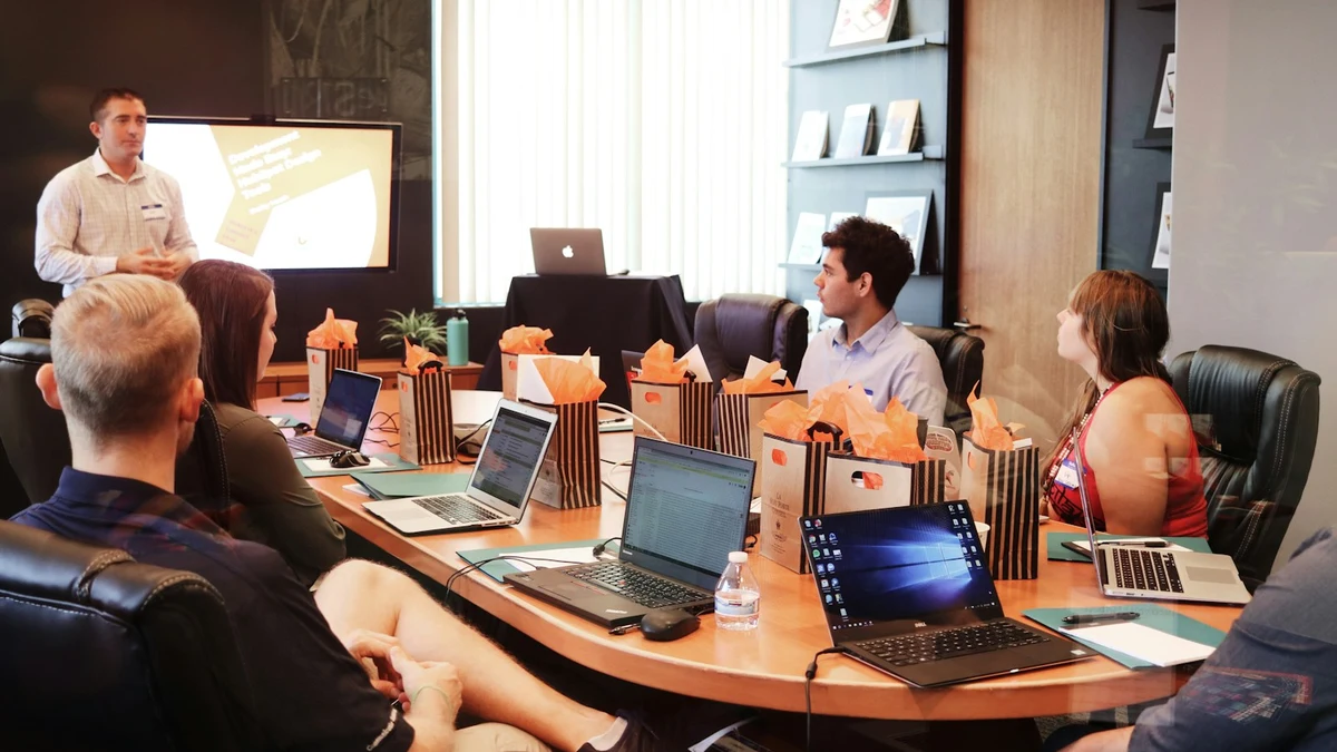 Founders presenting investor pitch deck in boardroom meeting